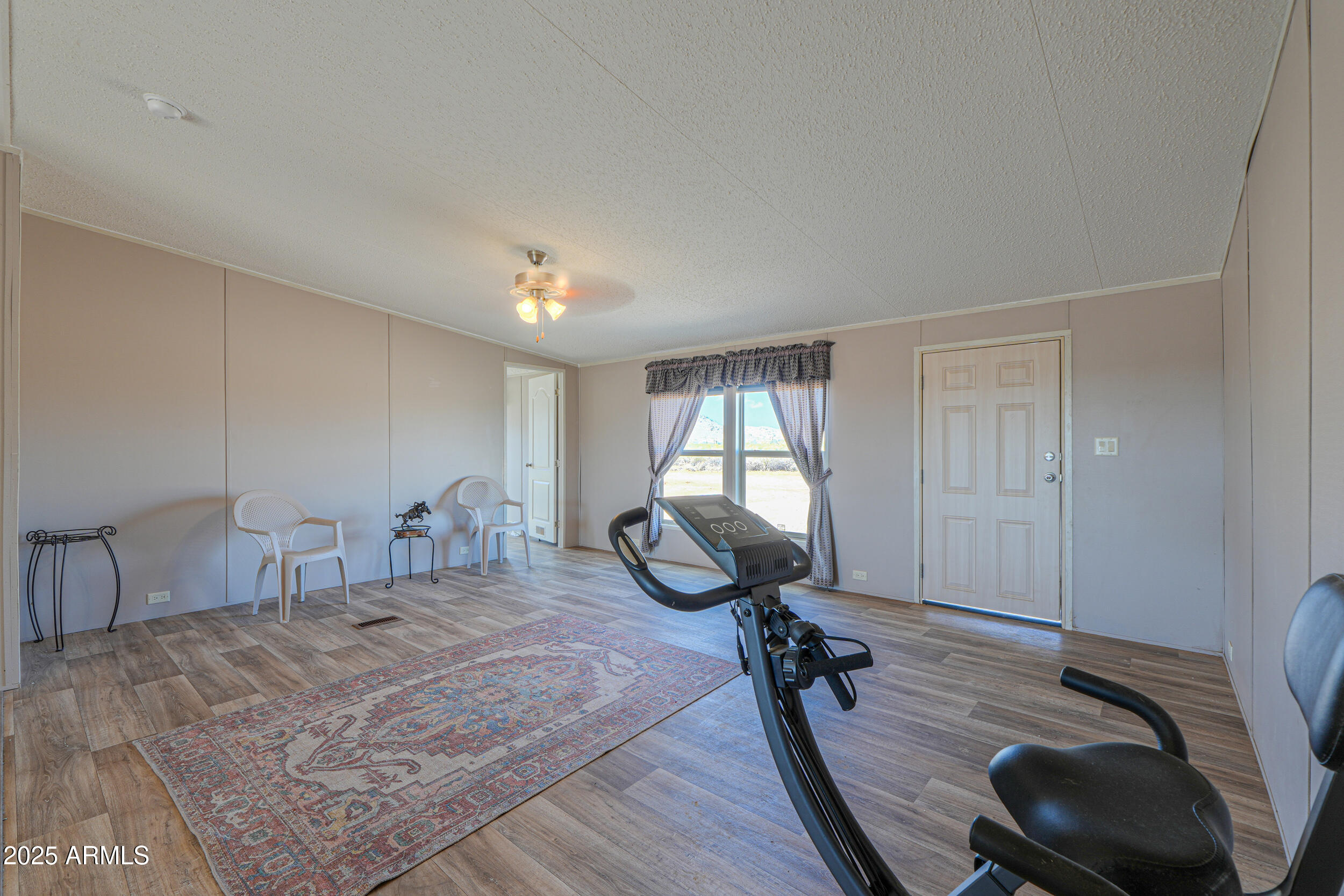 11091 North Garduno Road Maricopa, AZ 85139 - Photo 6 of 51 a room with lots of chairs and mirrors