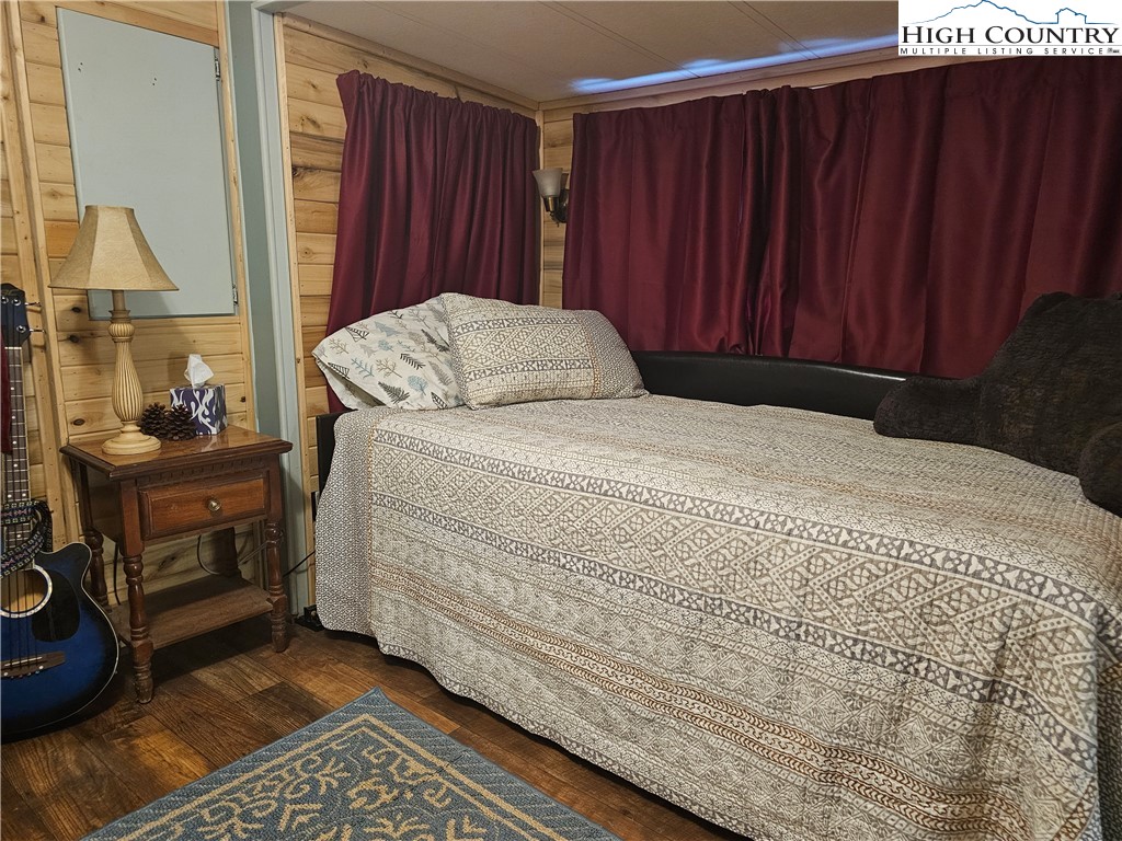 184 Trillium Road Newland, NC 28657 - Photo 13 of 15 a bedroom with a bed and a dresser