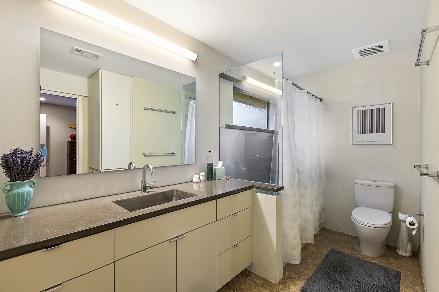 805 Cumberland Road, Unit B Austin, TX 78704 - Photo 24 of 37 Here is the full bathroom that is located upstairs and is attached to both bedrooms. It features concrete countertops and a full tub/shower combo.