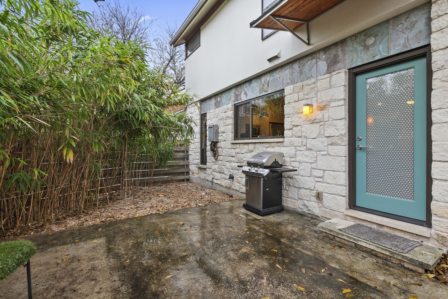 805 Cumberland Road, Unit B Austin, TX 78704 - Photo 30 of 37 This is a view of the front courtyard that is located off the kitchen area. It is lined with bamboo for privacy. This is a great spot for you to bring your grill or dine al fresco!
