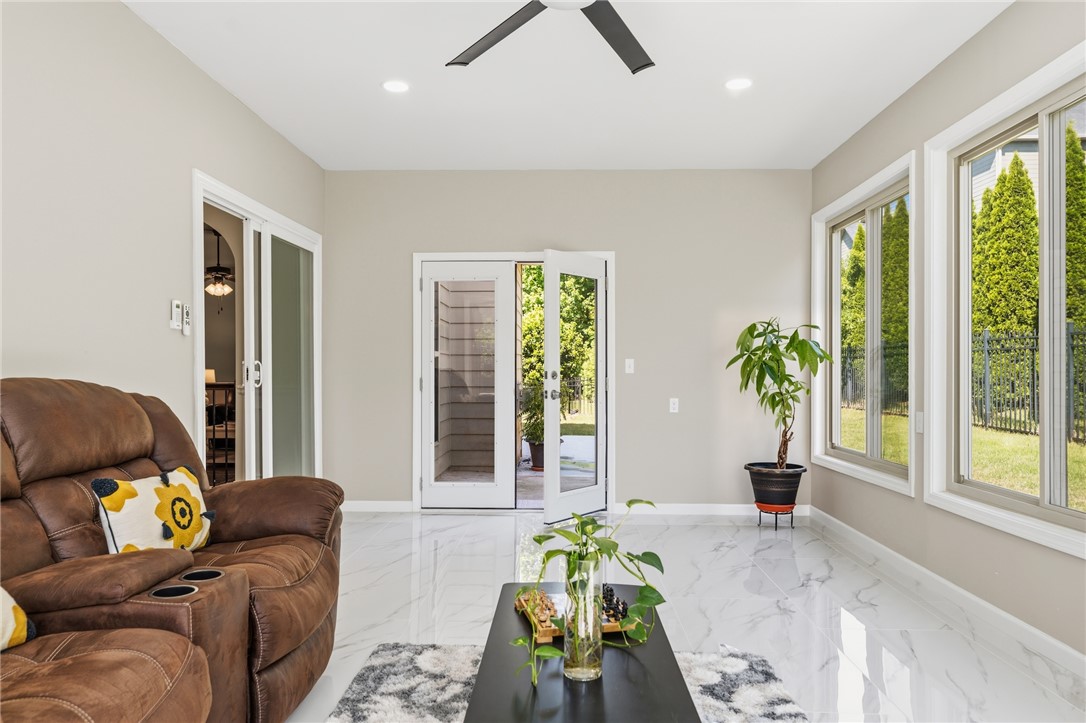 5 Tolkien Drive Anderson, SC 29621 - Photo 33 of 36 Polished stone-look tile flooring and abundant natural light define this versatile sun room space.