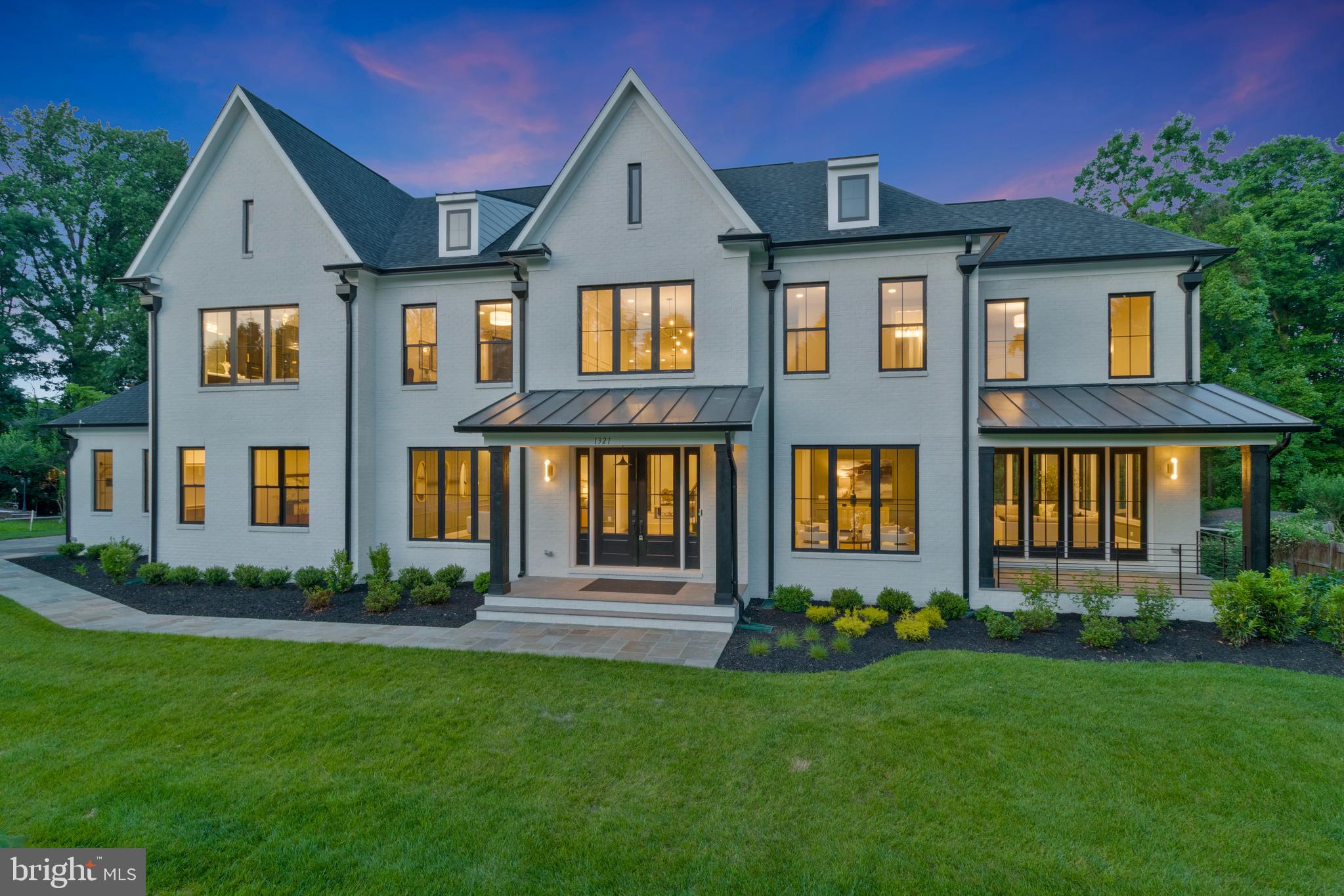 1321 Hunter Mill Road Vienna, VA 22182 - Photo 1 of 92 a front view of a house with a yard