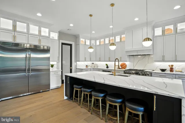 a bedroom with a large bed and a large window