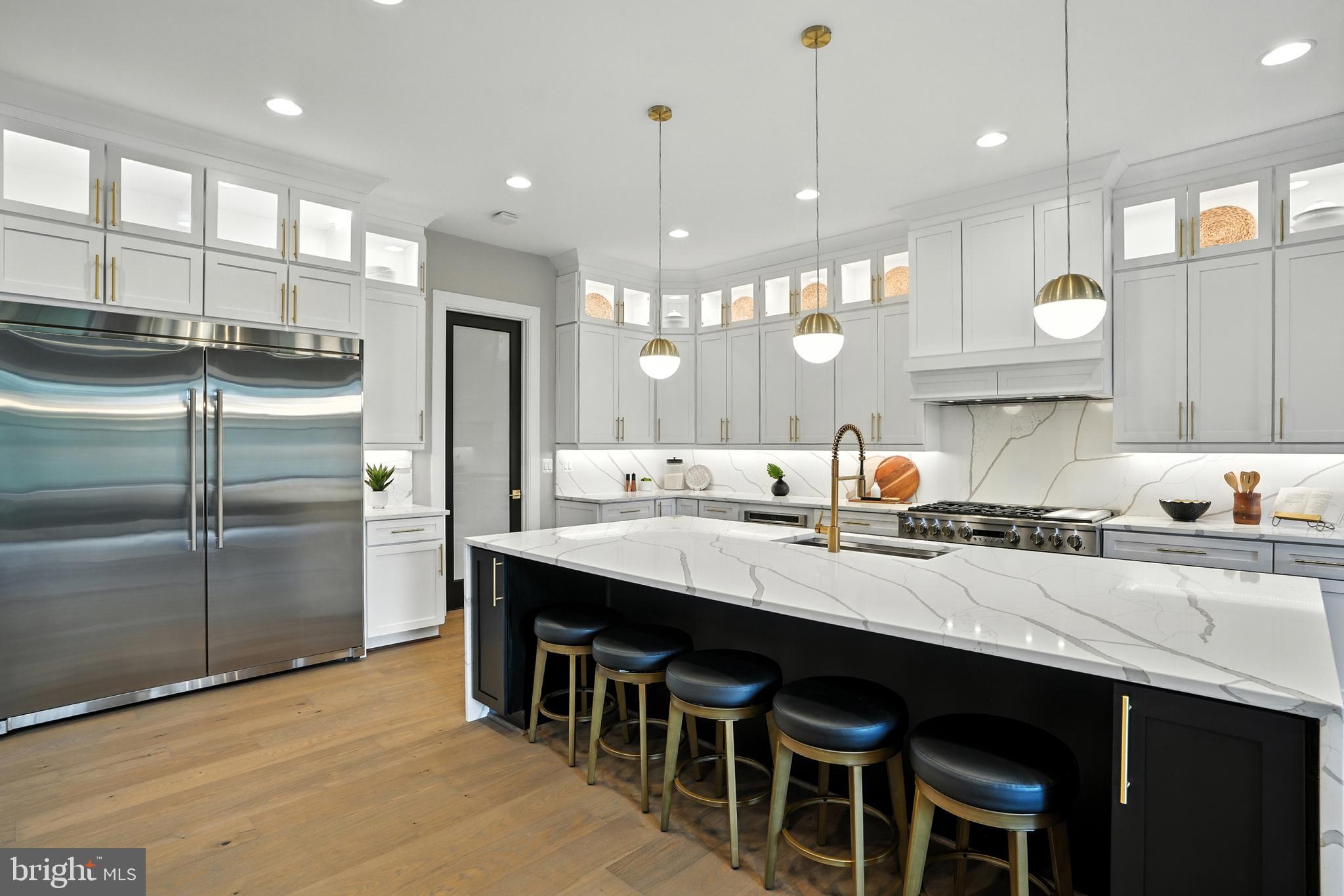1321 Hunter Mill Road Vienna, VA 22182 - Photo 13 of 92 a large kitchen with a table and chairs in it