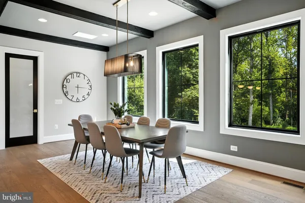 a bathroom with a glass door shower and a sink