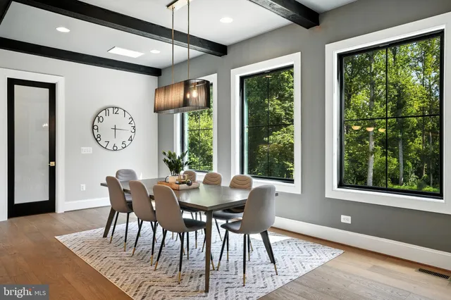 a bathroom with a glass door shower and a sink
