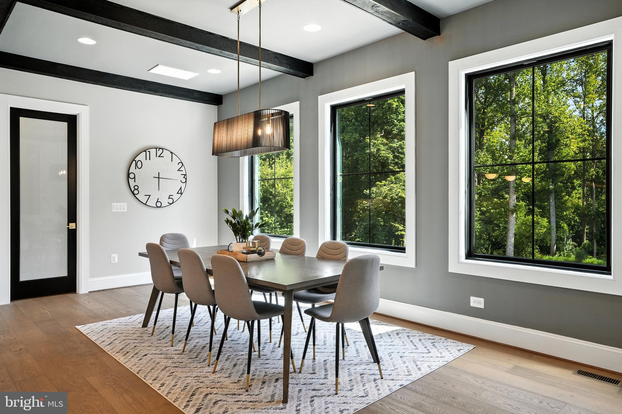 1321 Hunter Mill Road Vienna, VA 22182 - Photo 17 of 92 a view of a dining room with furniture window and wooden floor