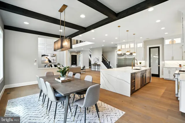 a white bath tub sitting in a bathroom next to a window