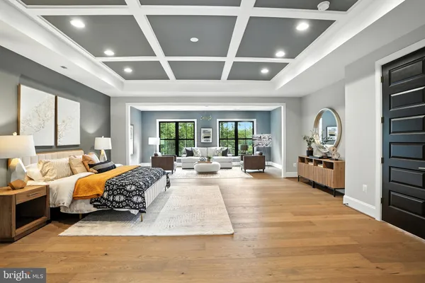 a living room with furniture a rug and white walls