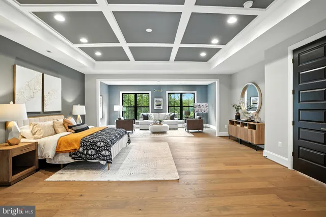 a living room with furniture a rug and white walls