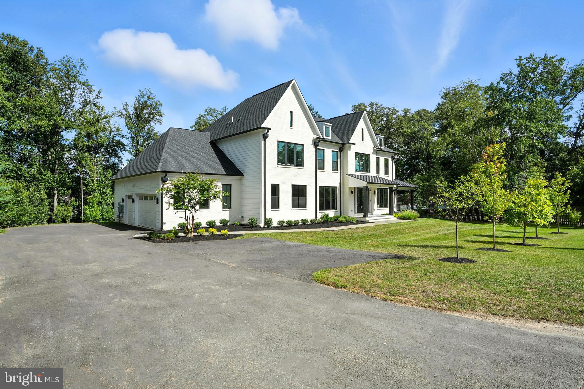 1321 Hunter Mill Road Vienna, VA 22182 - Photo 3 of 92 a front view of a house with a yard