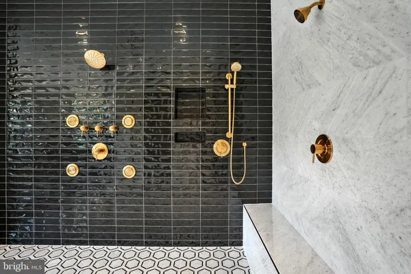 a living room with furniture and floor to ceiling windows