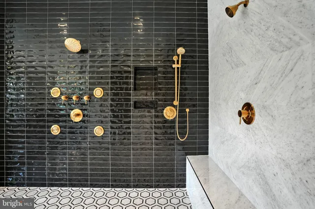 a living room with furniture and floor to ceiling windows