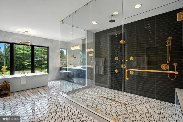 a living room with furniture and large windows