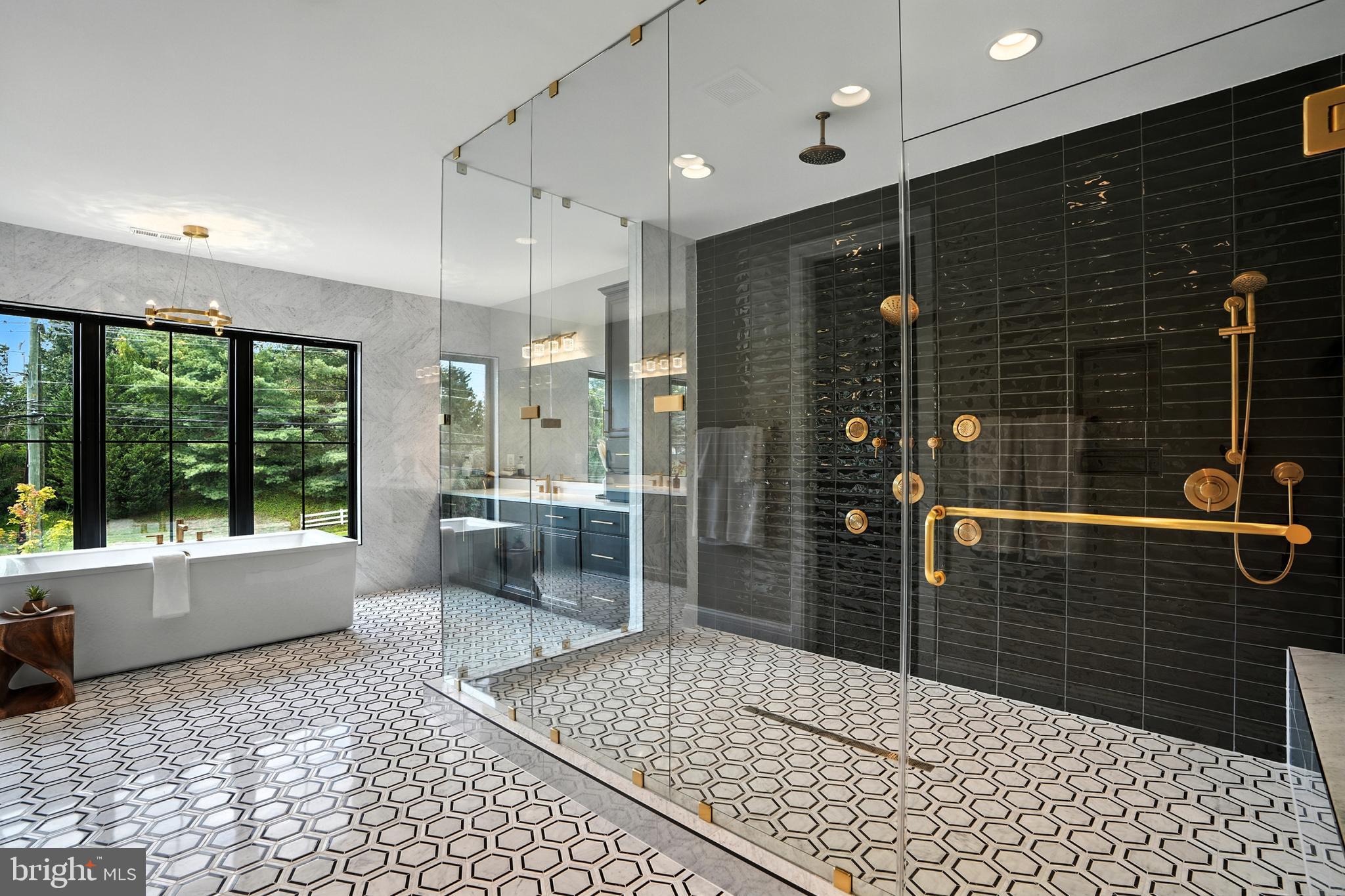 1321 Hunter Mill Road Vienna, VA 22182 - Photo 33 of 92 a bathroom with a glass door shower and a sink