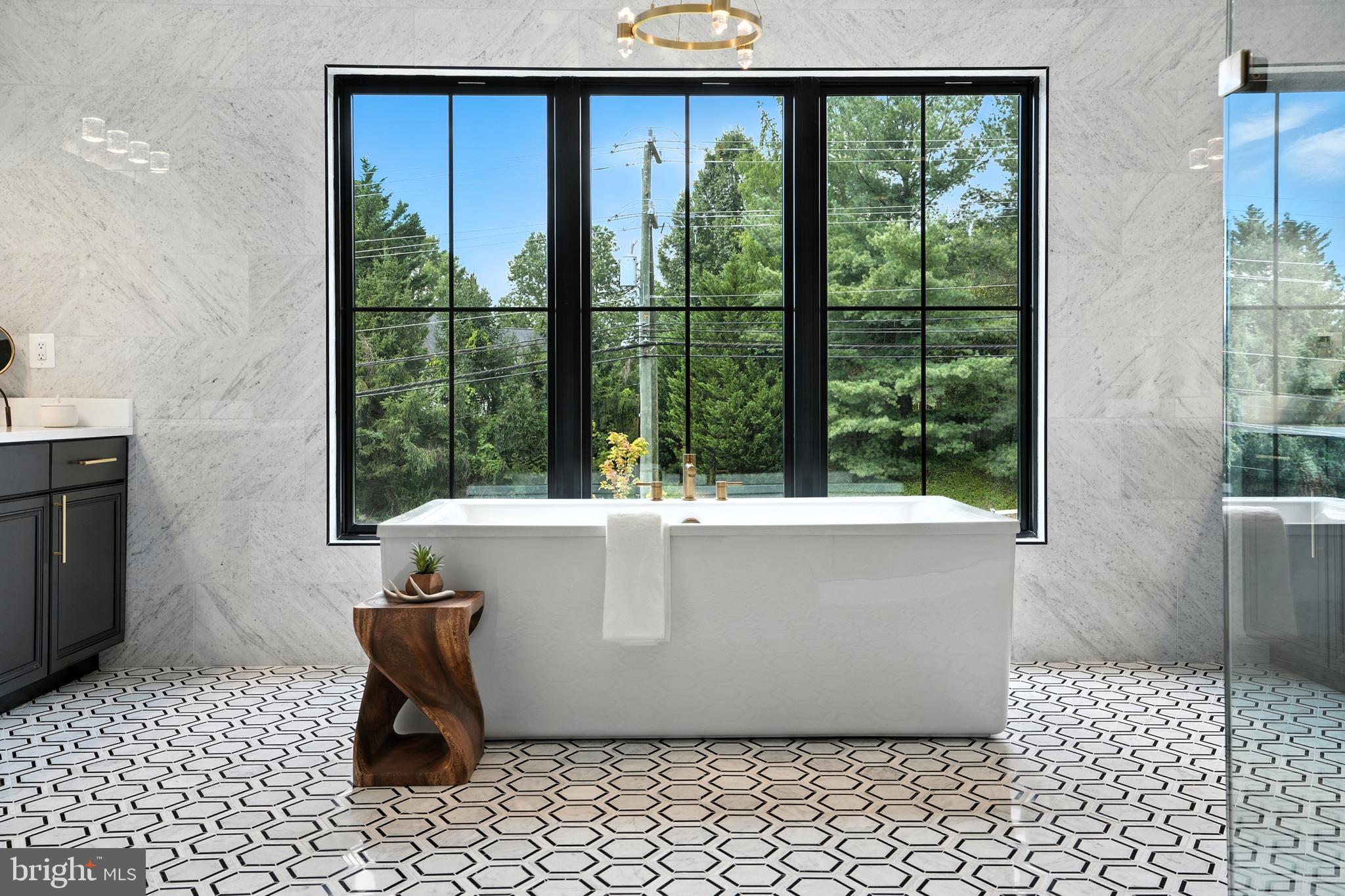 1321 Hunter Mill Road Vienna, VA 22182 - Photo 34 of 92 a white bath tub sitting in a bathroom next to a window