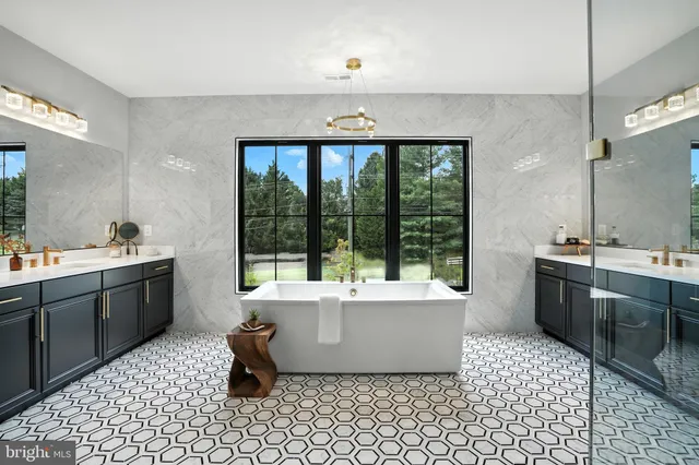 a kitchen with a dining table chairs and white cabinets