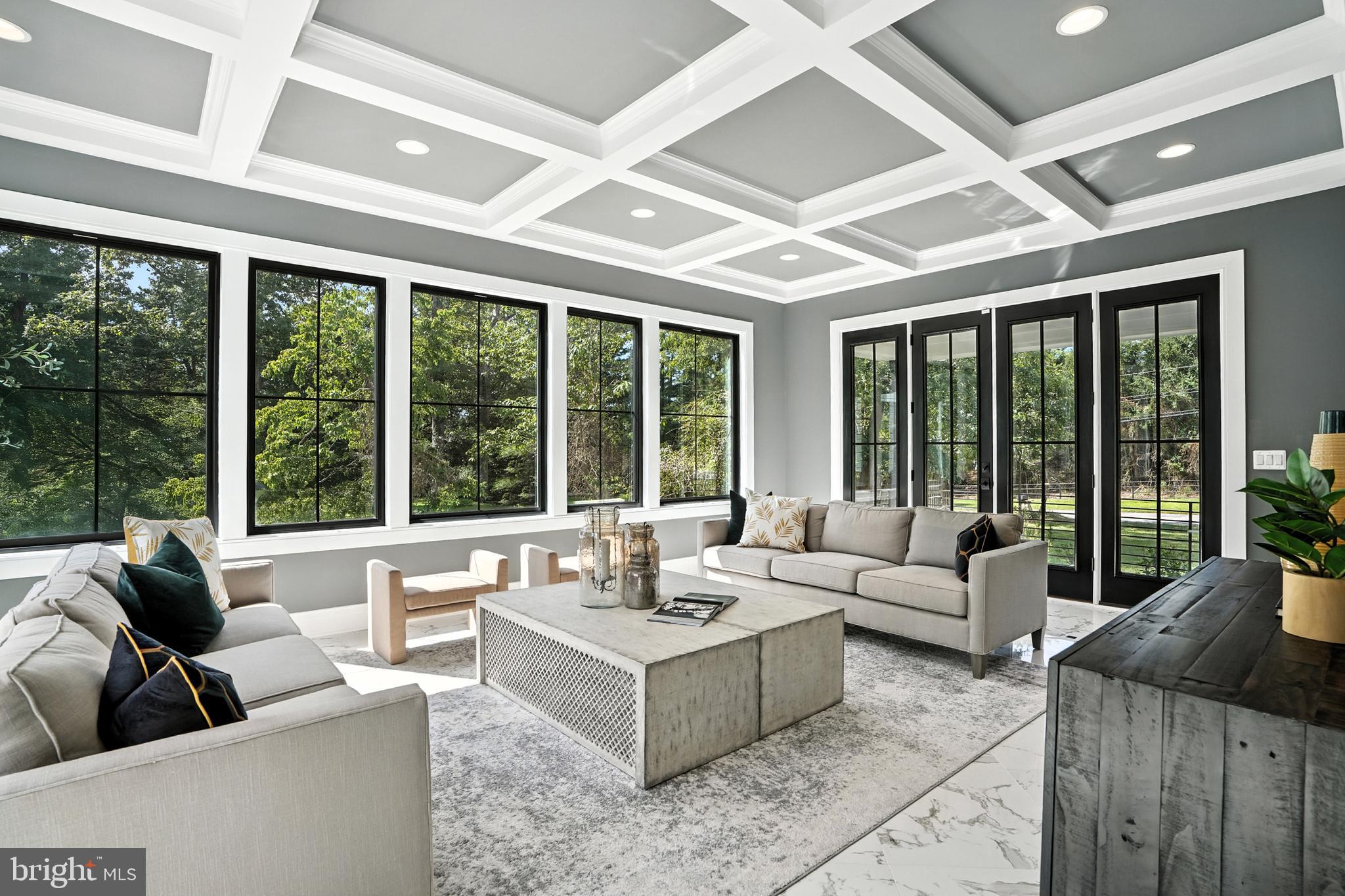 1321 Hunter Mill Road Vienna, VA 22182 - Photo 61 of 92 a living room with furniture and floor to ceiling windows