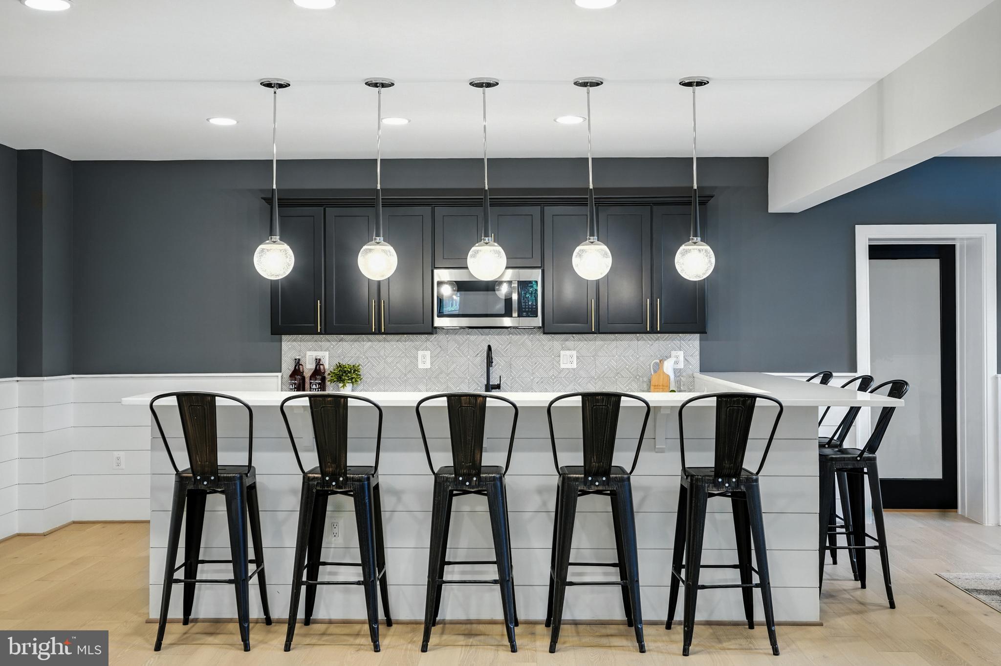 1321 Hunter Mill Road Vienna, VA 22182 - Photo 66 of 92 a view of a dining room with furniture and chandelier