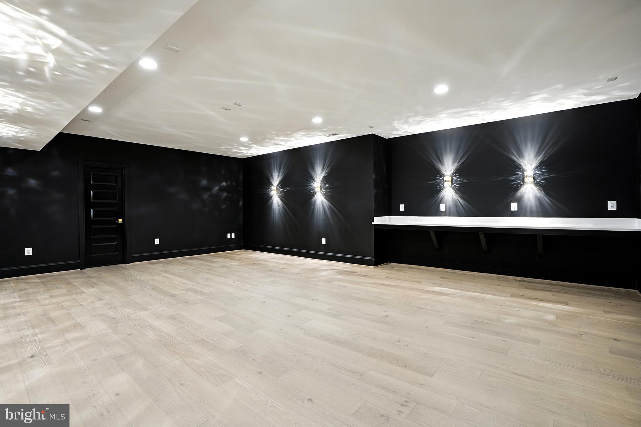 1321 Hunter Mill Road Vienna, VA 22182 - Photo 77 of 92 a view of an empty room with a projector