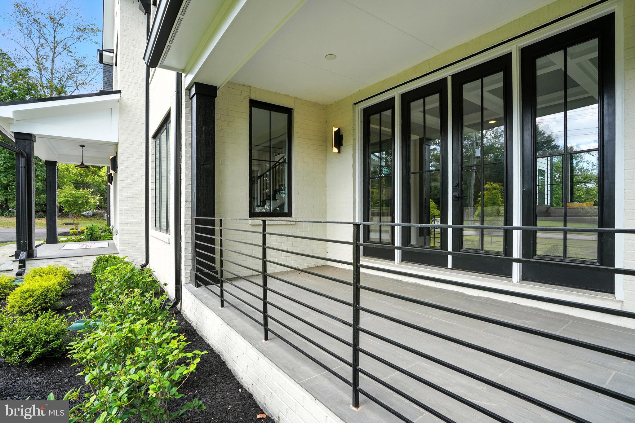 1321 Hunter Mill Road Vienna, VA 22182 - Photo 82 of 92 a view of a balcony with a potted plant