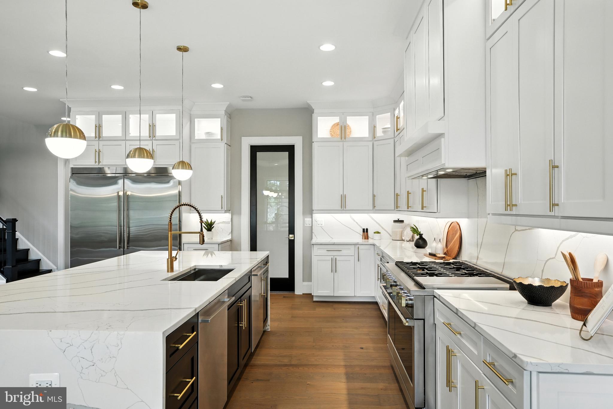 1321 Hunter Mill Road Vienna, VA 22182 - Photo 10 of 92 a kitchen with a sink stove and cabinets