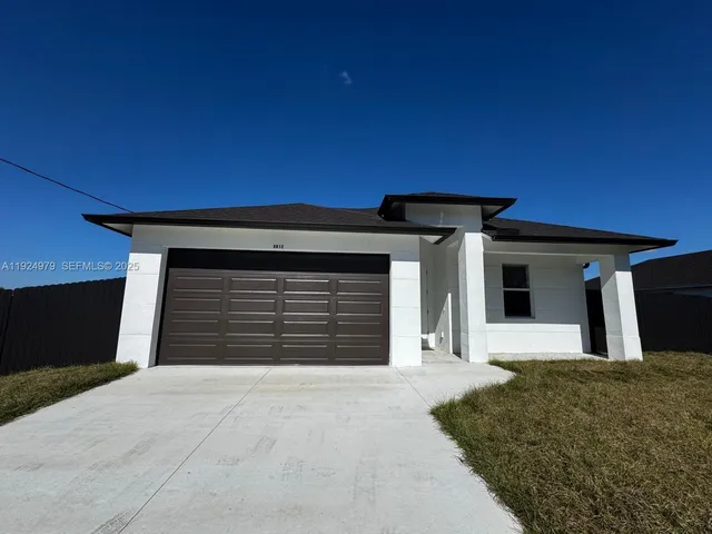 a front view of a house with a garage