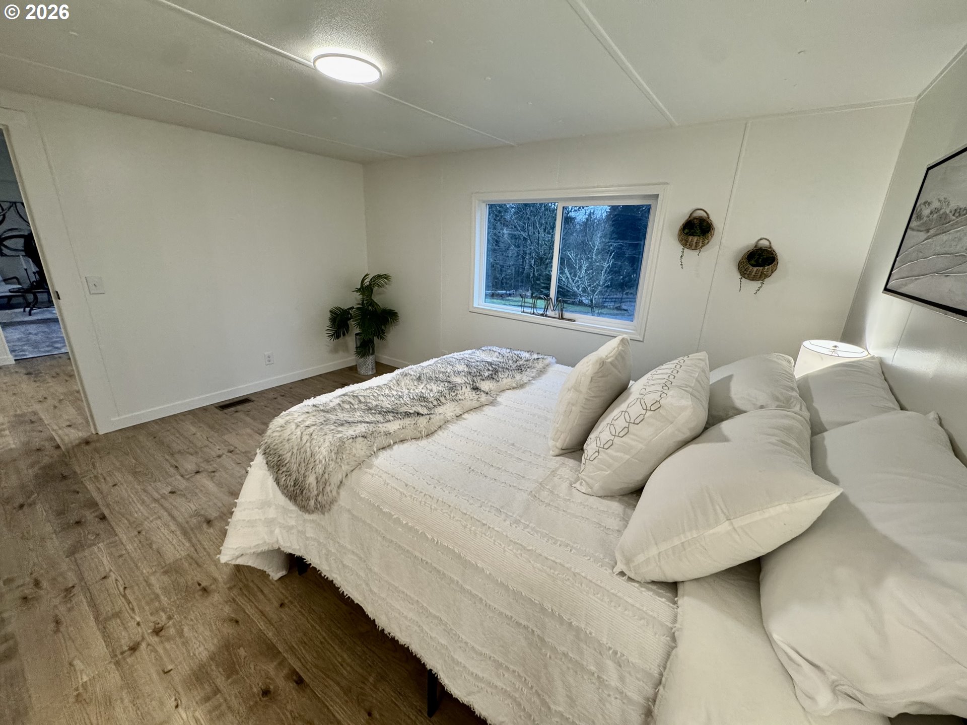 8138 Lewis River Road Ariel, WA 98603 - Photo 18 of 24 a bedroom with a bed and a window