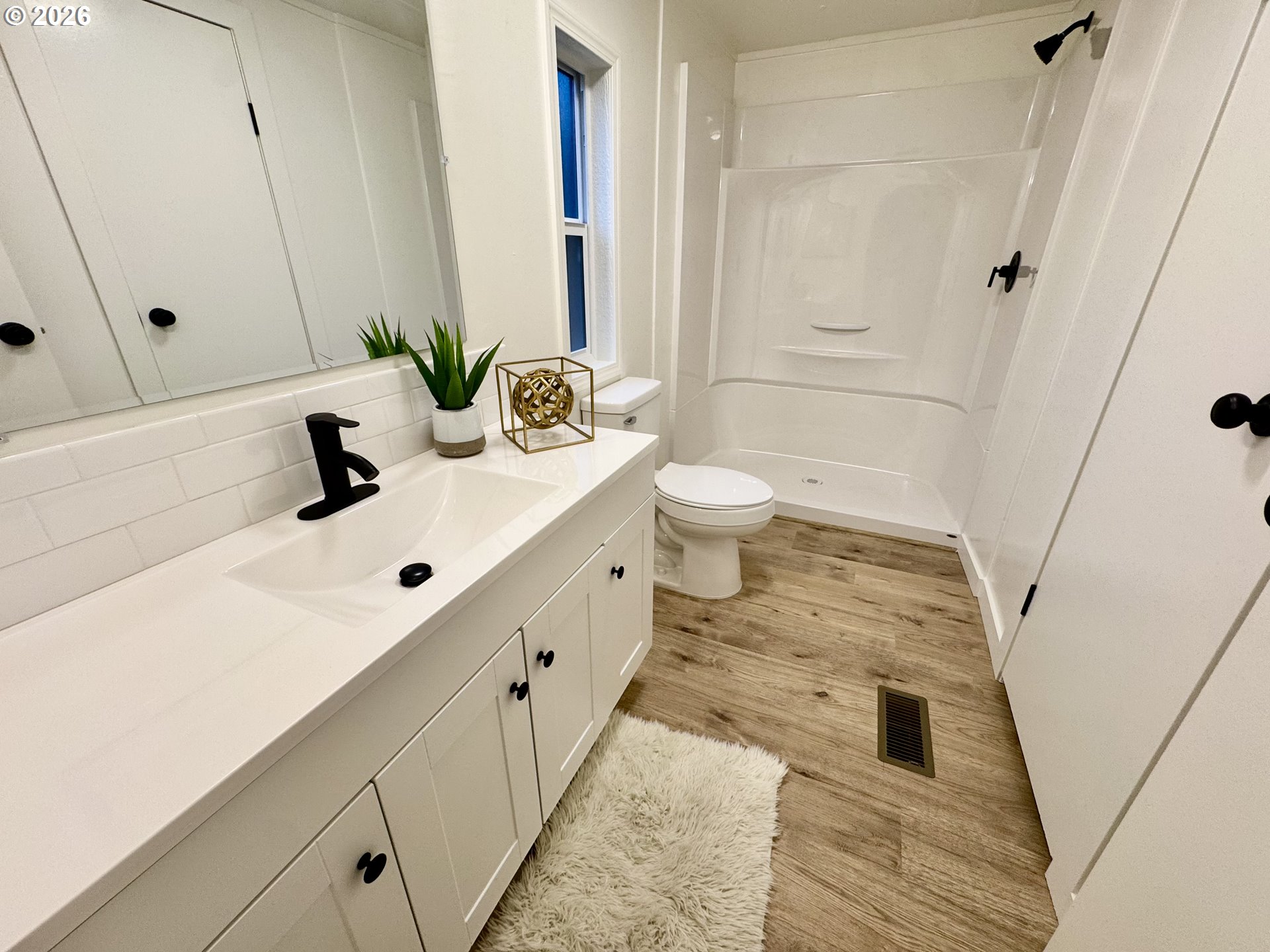 8138 Lewis River Road Ariel, WA 98603 - Photo 19 of 24 a bathroom with a sink a toilet and shower