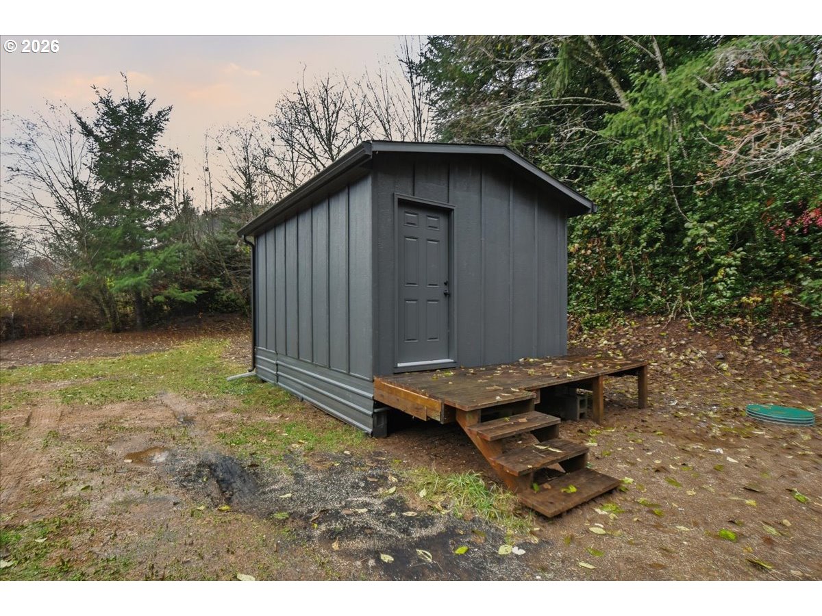 8138 Lewis River Road Ariel, WA 98603 - Photo 6 of 24 a backyard of a house with yard barbeque oven and outdoor seating