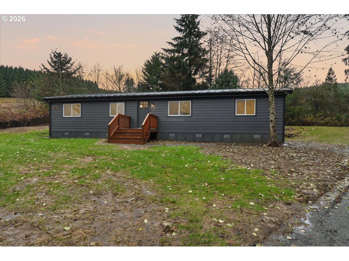 8138 Lewis River Road Ariel, WA 98603 - Photo 10 of 24 a backyard of a house with table and chairs