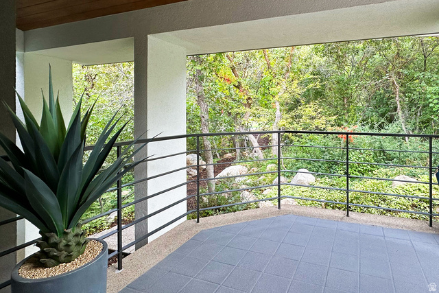 11454 South Oberland Road Sandy, UT 84092 - Photo 73 of 103 Balcony with black metal railings and tiled flooring