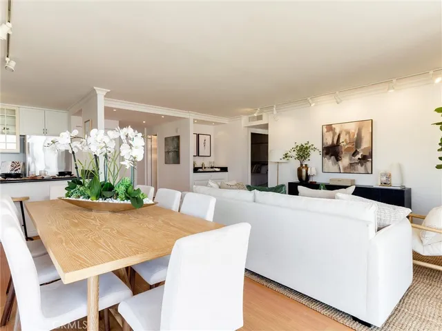 a kitchen with stainless steel appliances granite countertop a refrigerator and a stove