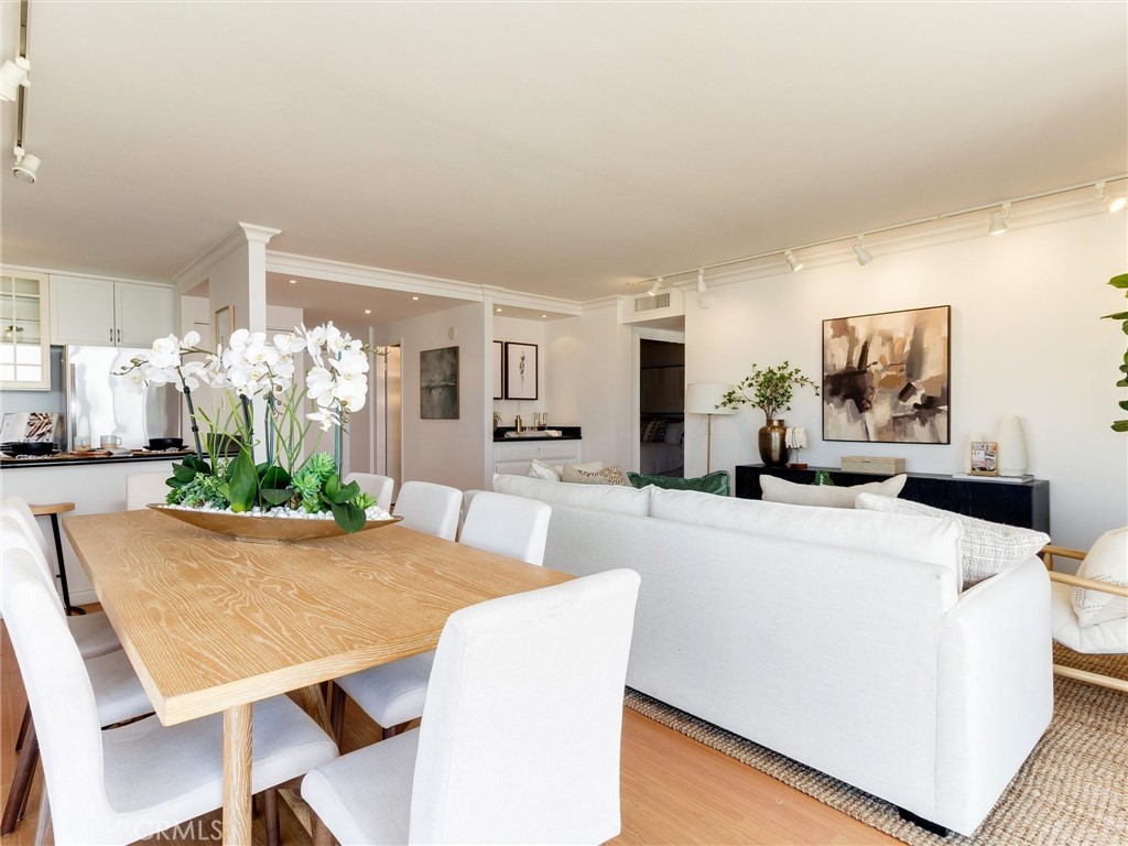 1750 East Ocean Boulevard, Unit 213 Long Beach, CA 90802 - Photo 13 of 52 a view of a dining room with furniture and a large window