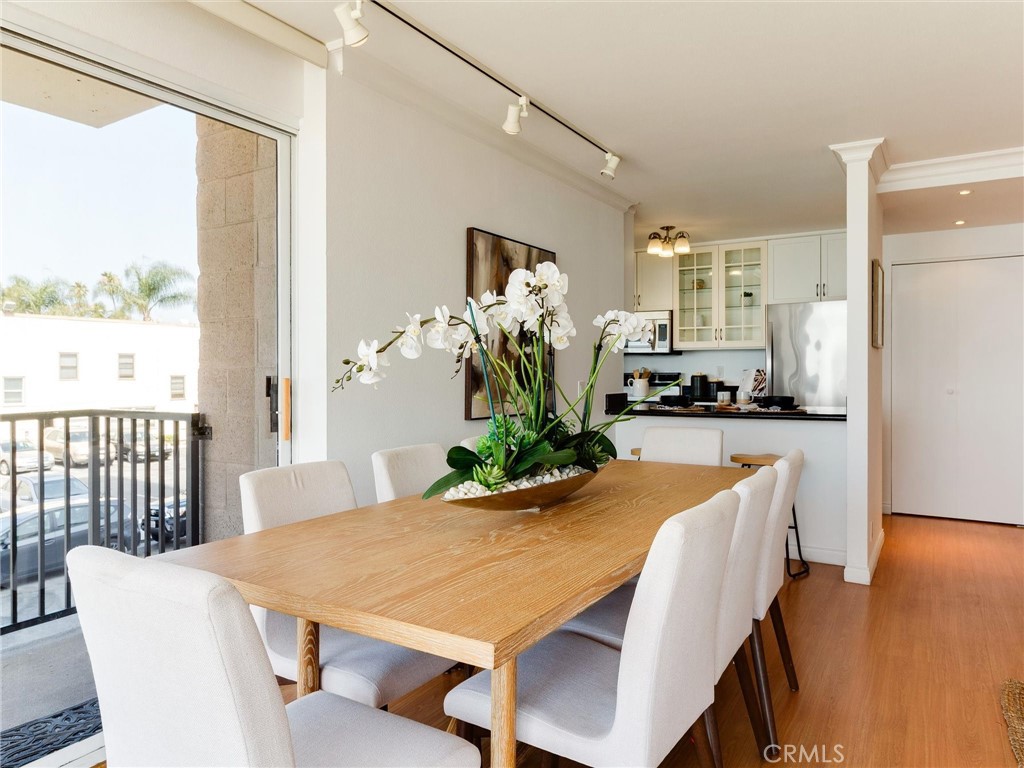 1750 East Ocean Boulevard, Unit 213 Long Beach, CA 90802 - Photo 14 of 52 a view of a dining room with furniture window and wooden floor