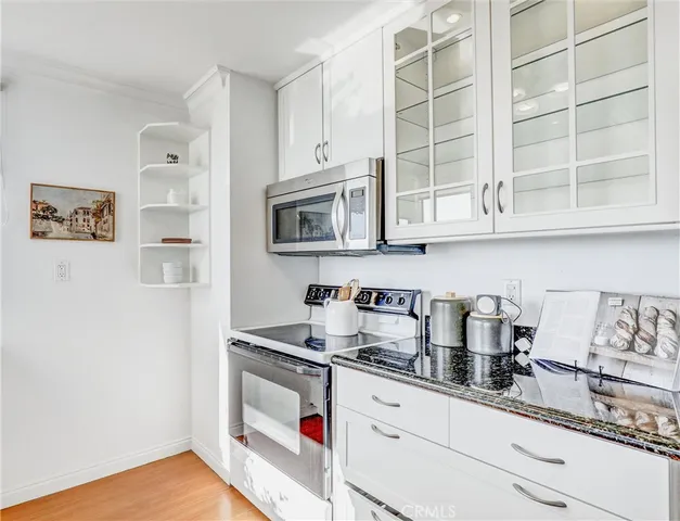 a bedroom with a large bed and a large window