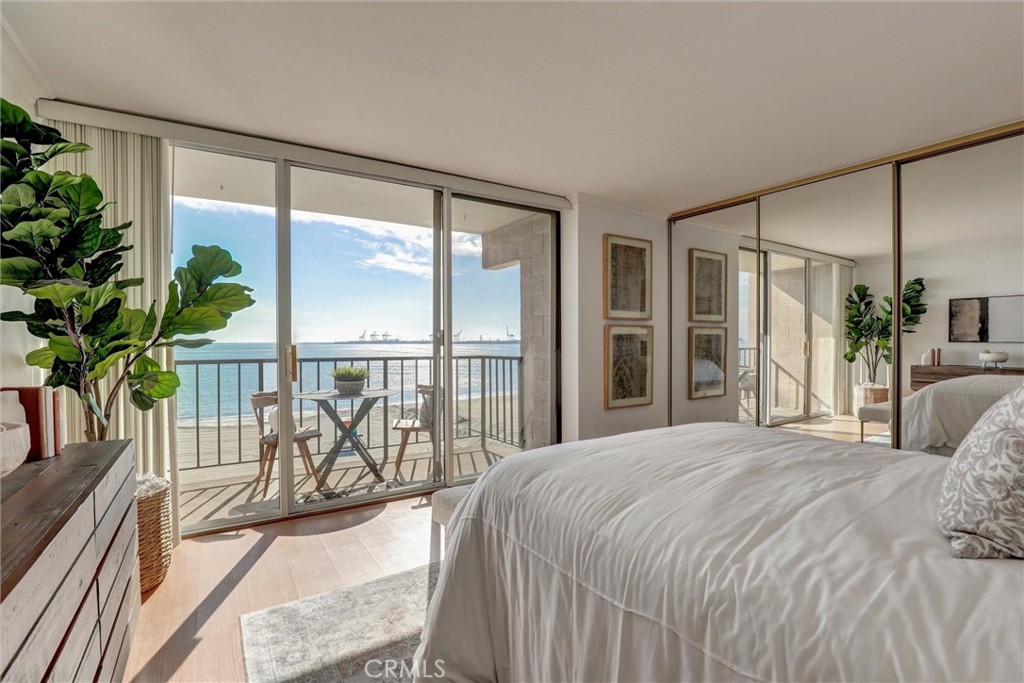 1750 East Ocean Boulevard, Unit 213 Long Beach, CA 90802 - Photo 22 of 52 a large bedroom with a large window and a balcony