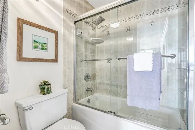 a view of a terrace with lawn chairs