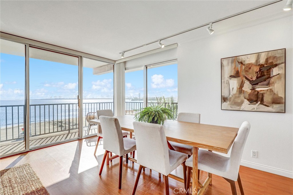 1750 East Ocean Boulevard, Unit 213 Long Beach, CA 90802 - Photo 3 of 52 a view of a dining room with furniture window and wooden floor