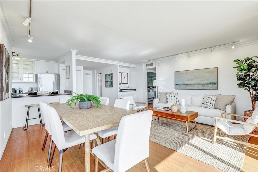 1750 East Ocean Boulevard, Unit 213 Long Beach, CA 90802 - Photo 4 of 52 a living room with furniture and wooden floor