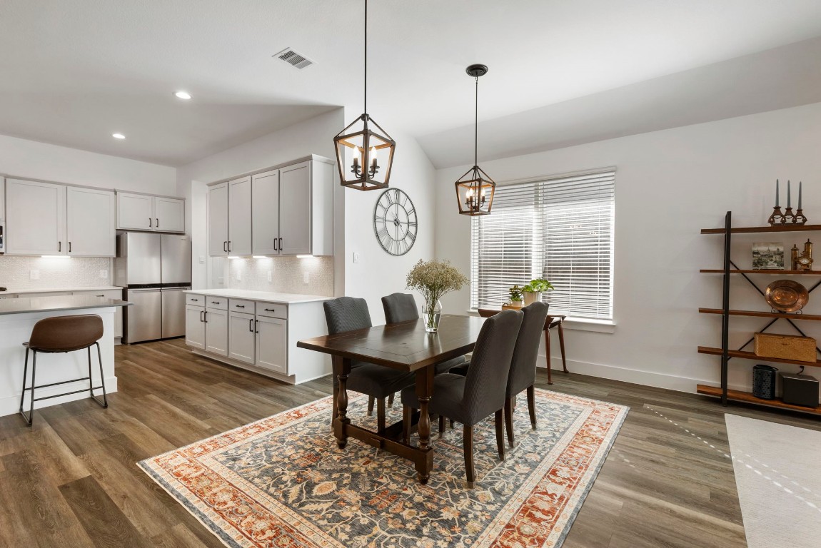 13757 Rising Sun Lane Conroe, TX 77384 - Photo 11 of 39 a view of a dining room with furniture window and wooden floor