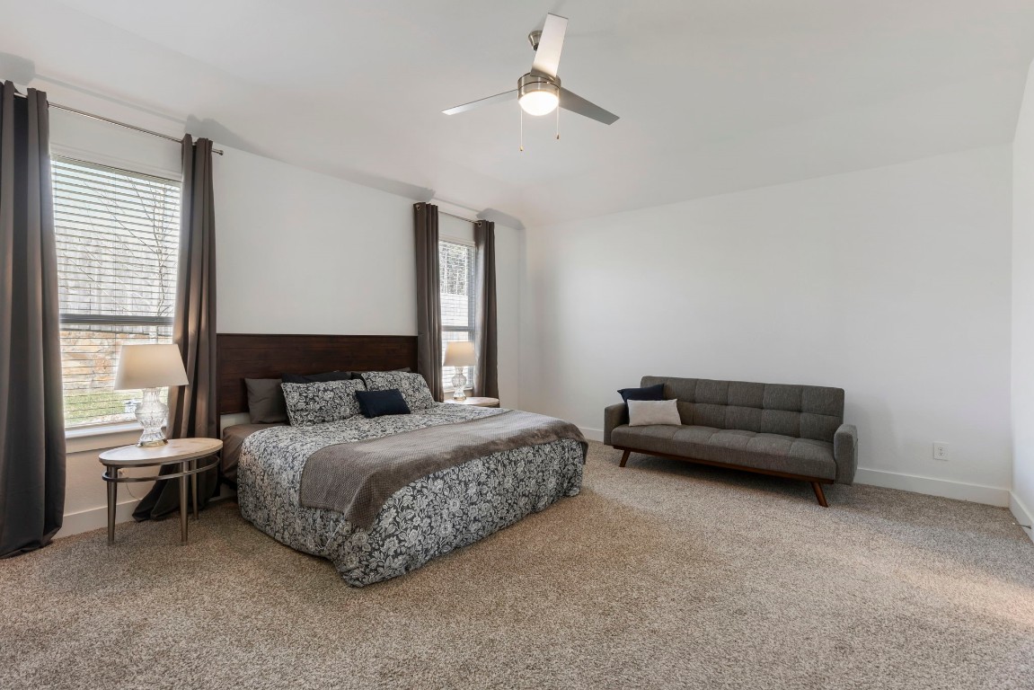 13757 Rising Sun Lane Conroe, TX 77384 - Photo 15 of 39 a bedroom with a bed and a couch