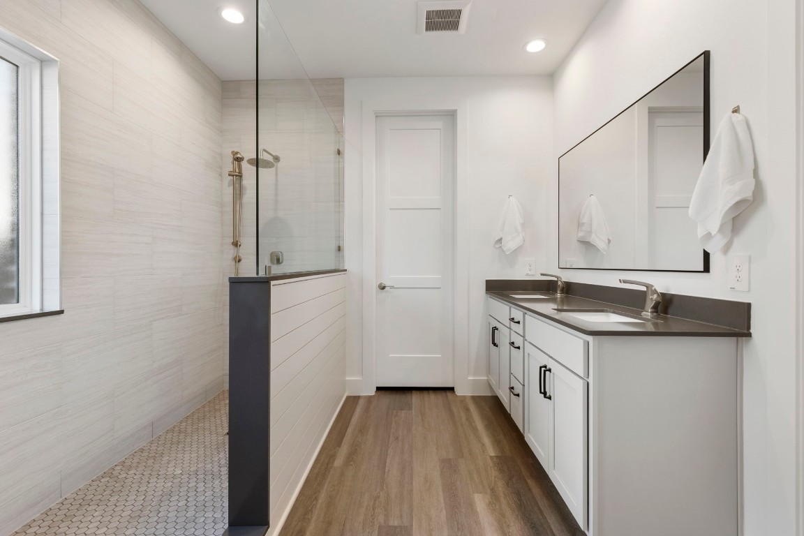 13757 Rising Sun Lane Conroe, TX 77384 - Photo 16 of 39 a bathroom with granite countertop double vanity and a granite counter tops