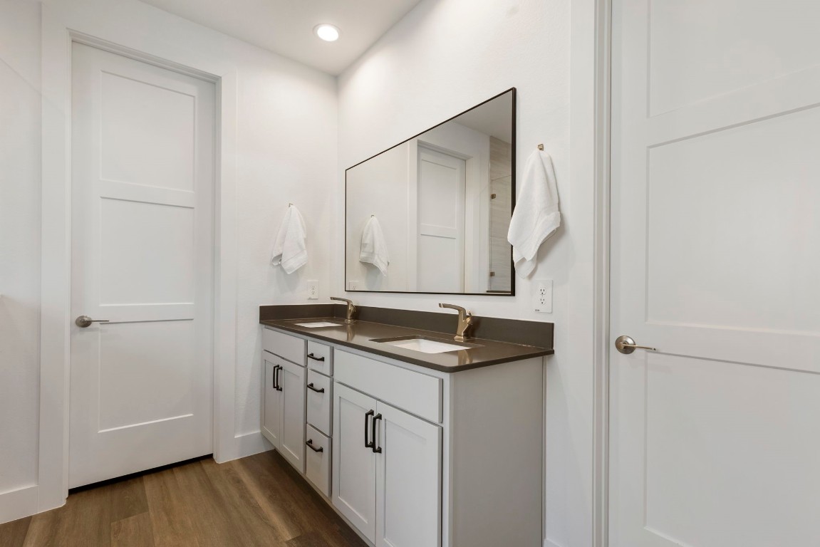 13757 Rising Sun Lane Conroe, TX 77384 - Photo 20 of 39 a bathroom with a granite countertop sink and a mirror