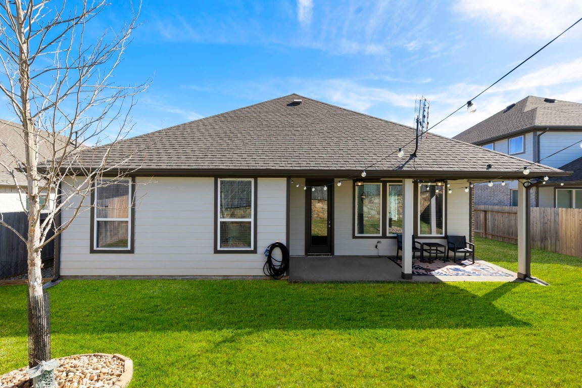 13757 Rising Sun Lane Conroe, TX 77384 - Photo 30 of 39 a backyard of a house with barbeque oven table and chairs