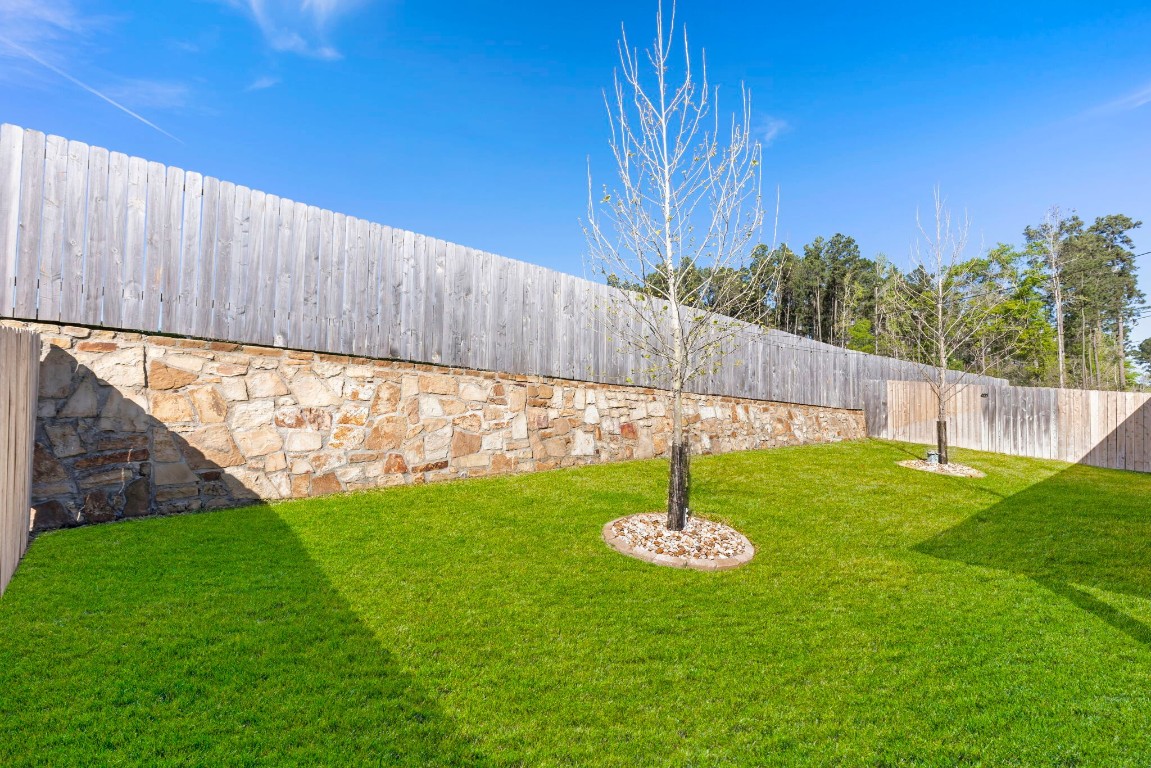 13757 Rising Sun Lane Conroe, TX 77384 - Photo 31 of 39 a view of yard with swimming pool and trees in the background