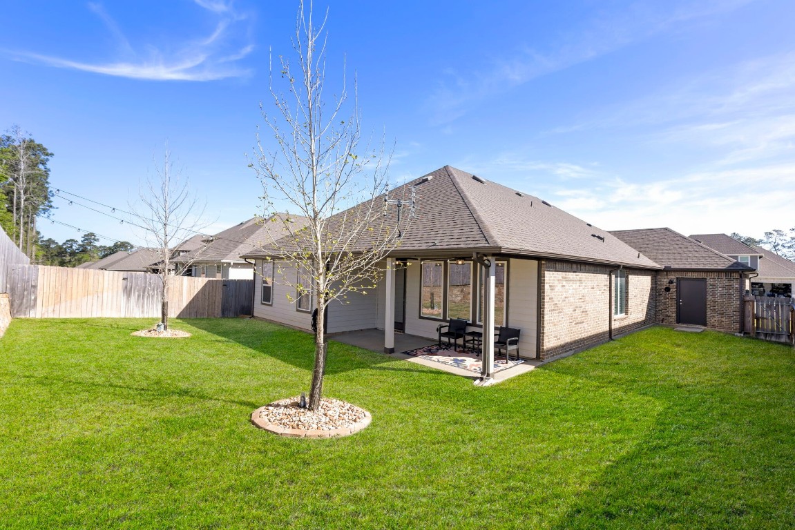 13757 Rising Sun Lane Conroe, TX 77384 - Photo 33 of 39 a front view of a house with a yard