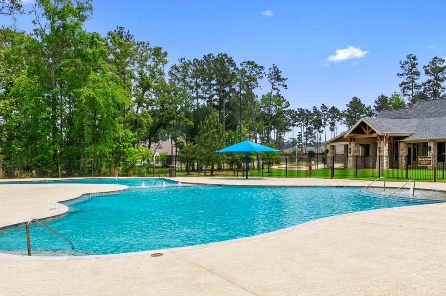 13757 Rising Sun Lane Conroe, TX 77384 - Photo 39 of 39 a view of a swimming pool and a yard