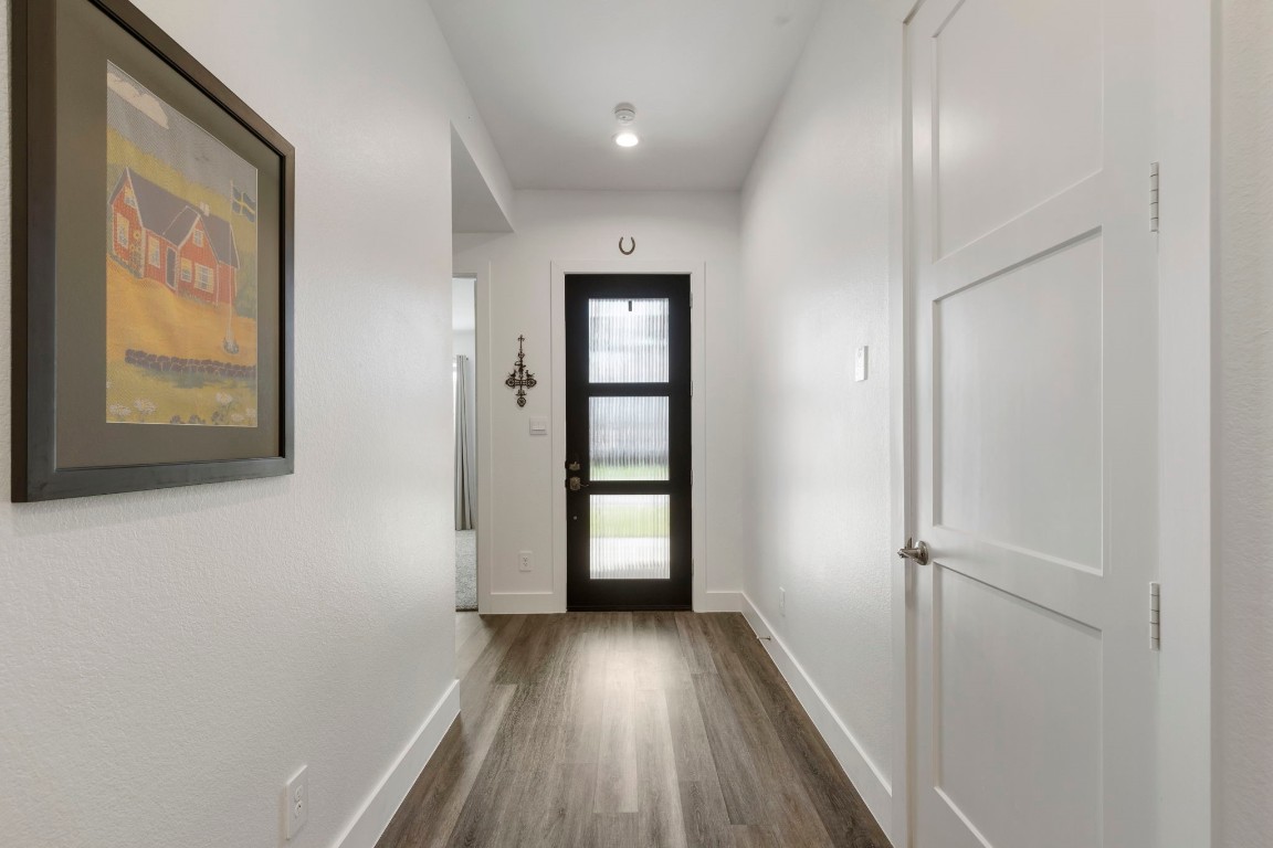 13757 Rising Sun Lane Conroe, TX 77384 - Photo 4 of 39 a view of an entryway with wooden floor