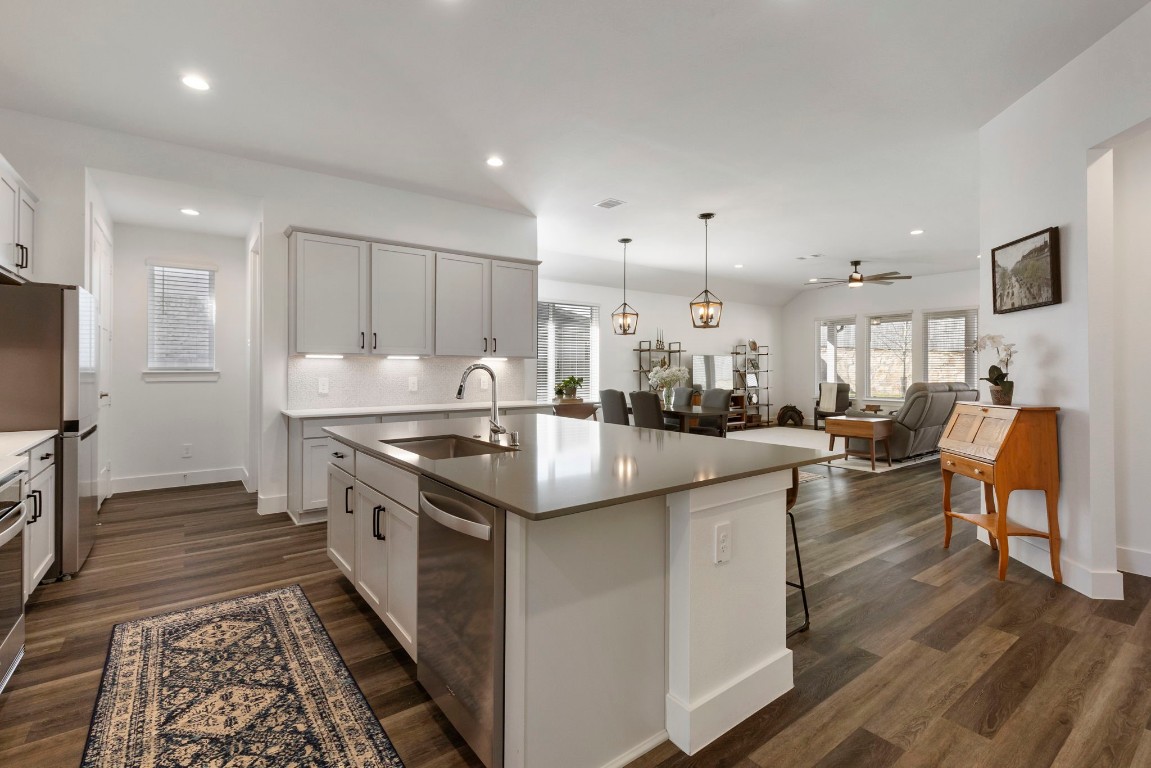 13757 Rising Sun Lane Conroe, TX 77384 - Photo 6 of 39 a kitchen with stainless steel appliances granite countertop a stove and a refrigerator